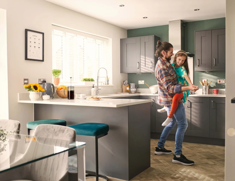 A father and daughter in a kitchen