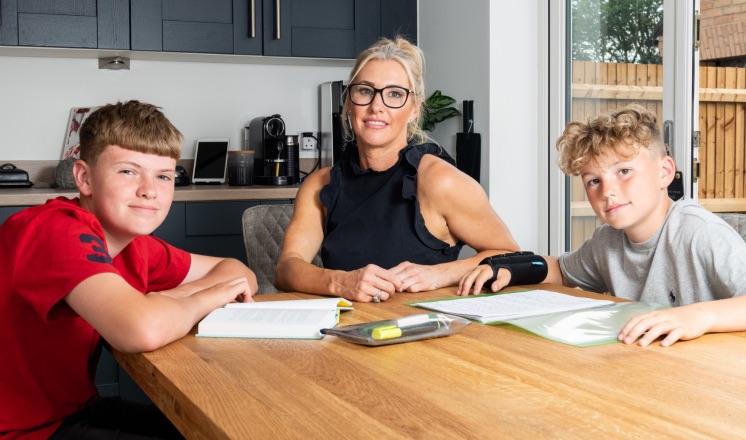 Family around dining table Family around dining table